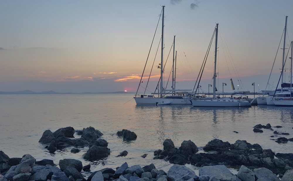 Naxos Greece: Travel Guide 2023 23 Photo of boats in Naxos Harbor at sunset, Naxos, Greece