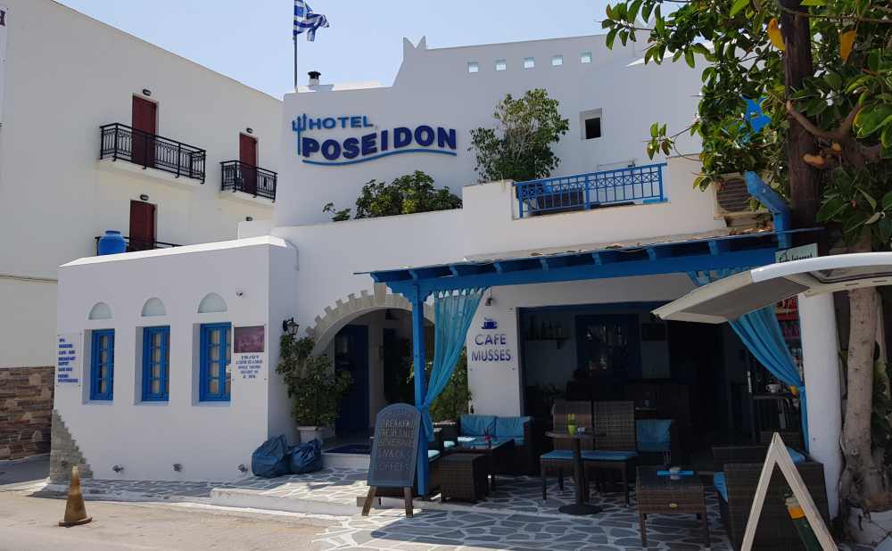Naxos Greece: Travel Guide 2023 24 Phot of the blue and white Hotel Poseidon, Naxos, Greece