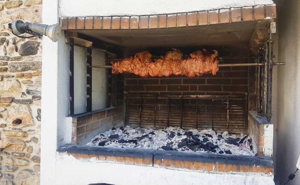 Naxos Greece: Travel Guide 2023 15 Photo of BBQ meat being roasted over coals in Halki Village Naxos