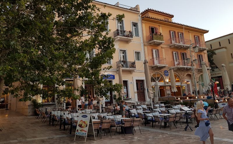 Things to see in Nafplio Greece 10 Where to eat in Nafplio - photo of outdoor cafes in a main square in Nafplio, Greece